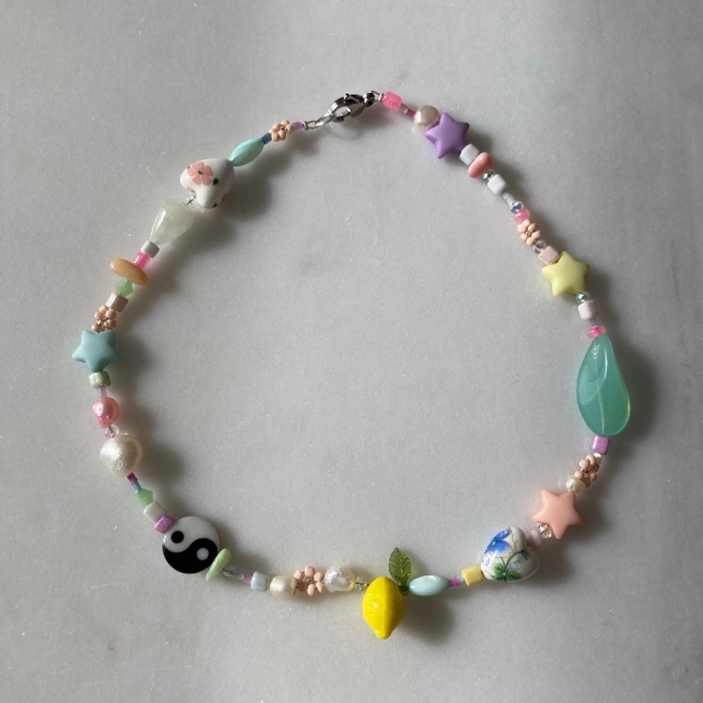 Fresh water pearl charm necklace
